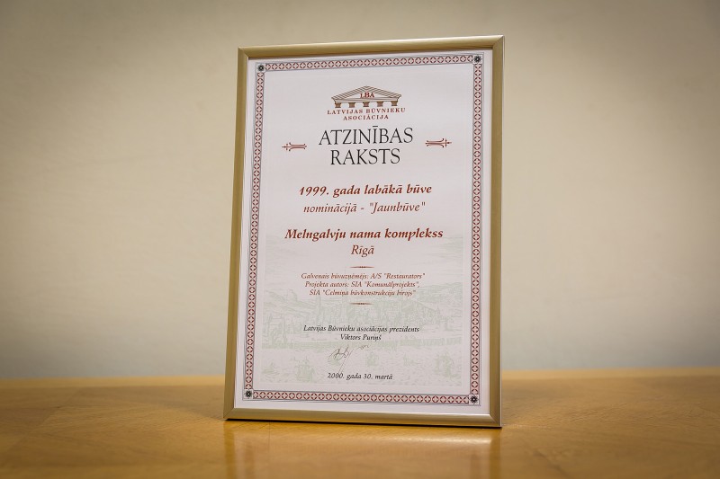 AS “Būvuzņēmums Restaurators” received recognition in the competition “Best Building 1999 [in Latvia]” in the category “New Building” on 30 March 2000. This award was granted for the restored complex of House of Blackheads located in Riga, 7 Ratslaukums. It was performed in 1999.