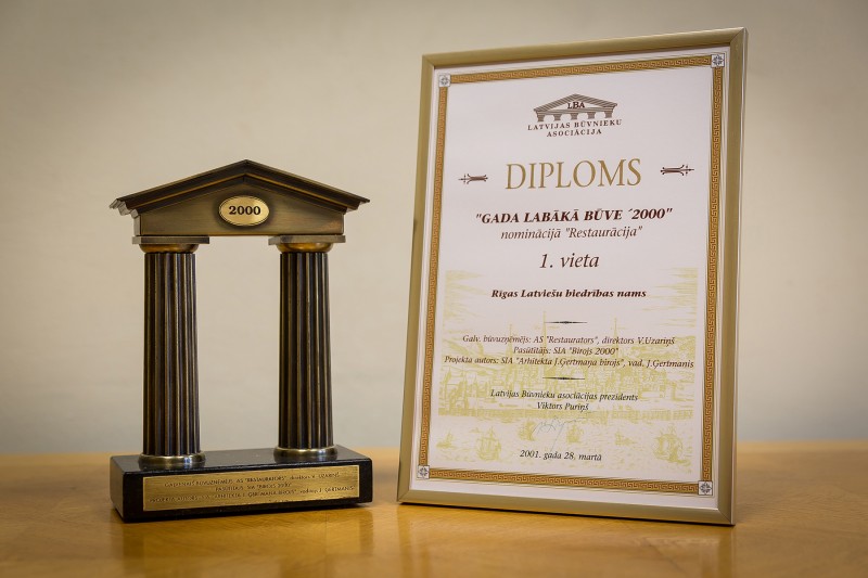 AS “Būvuzņēmums Restaurators” received recognition in the competition “Best Building 2000 [in Latvia]” in the category “Restoration” (1st place) on 28 March 2001. This award was granted for restoration works carried out in 2000 in the Riga Latvian Society House in Riga, 13 Merkela Street.